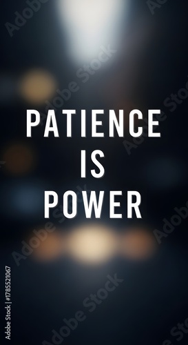 A motivational quote displayed in bold white letters on a dark blurred background emphasizing the message that patience is power