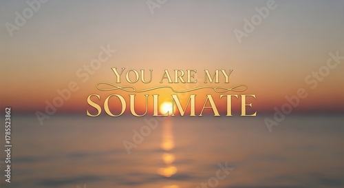 A serene sunset over a calm body of water with the inspirational message 'You Are My Soulmate' displayed in elegant text across the sky