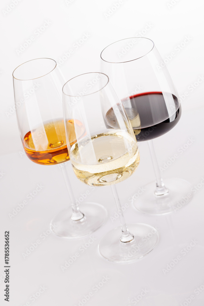 Fototapeta premium Different wine glasses on white background