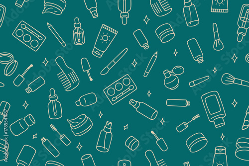A seamless pattern of various makeup and skincare products, such as lipsticks, brushes, and creams, on a blue background. Design for the beauty, fashion, and cosmetics industries.
