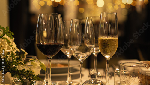 Red and white wine glasses on a beautifully set table, Fine dining and wine, Luxury table setting.