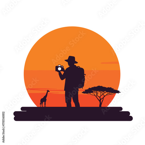 Silhouette of a photographer on an African safari, taking a picture against a large orange sunset with a giraffe.