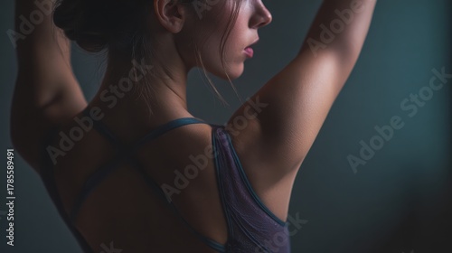 Graceful Profile of Young Woman in Soft Light with Relaxed Pose