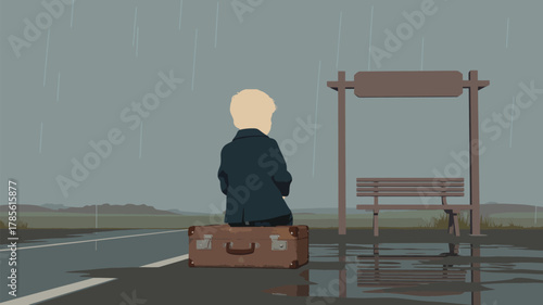 A person sits on a suitcase at a bus stop in the rain with a bench and road visible in the distance