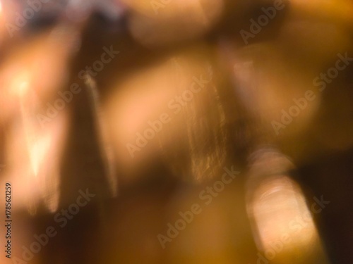 Bokeh background effect The atmosphere is very luxurious and precious. Glittering yellow gold diamonds fell. Contrasts beautifully with the black background.