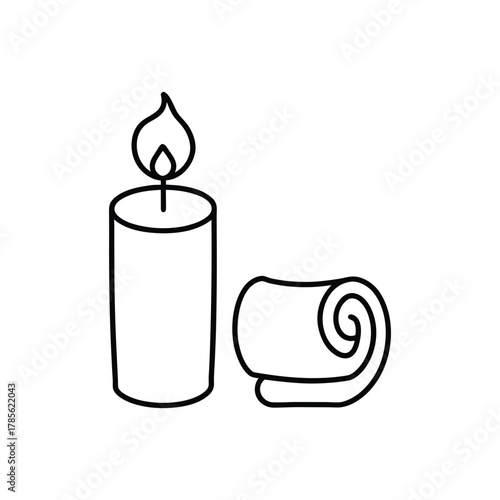 A calming spa scene with a lit candle and a rolled towel, symbolizing relaxation and wellness