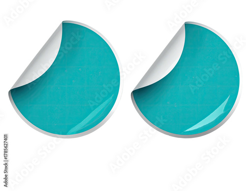 Two turquoise, textured circular stickers, one peeling at the corner