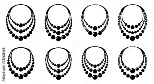 elegant black pearl necklaces arranged in two neat rows, isolated on white background 