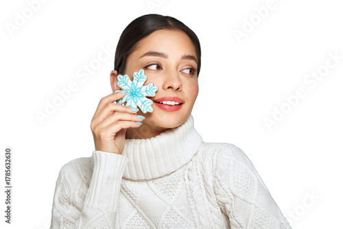 Woman in a white knitted sweater with cookie Snowflake isolated on transparent background. Christmas or New Year festivities. Holiday and Party