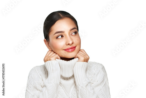 Portrait of young happy beautiful woman smiling and looking away, isolated on transparent background in a warm white sweater. Concept of winter promo sale