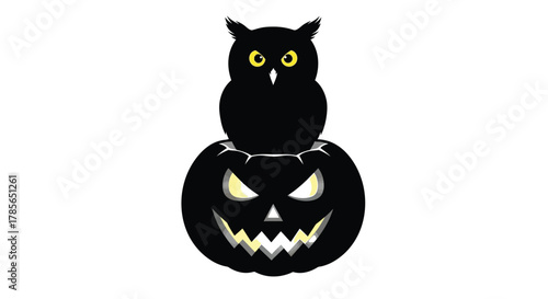 Spooky Halloween owl perched atop a scary glowing jack o' lantern