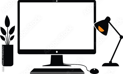 Black computer desk setup with monitor plant and lamp on white desktop keyboard