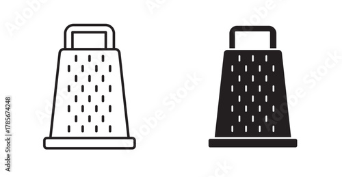 A grater tool that has a rough metal surface with small holes and is used to cut food into small pieces.