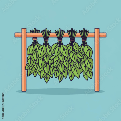 Bunches of green leaves drying on a wooden rack