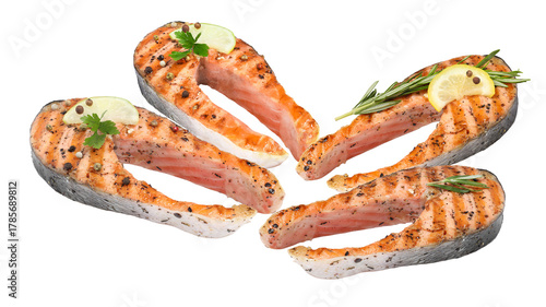 Konstfotografi appetizing display of four healthy grilled pink salmon steaks, beautifully garni