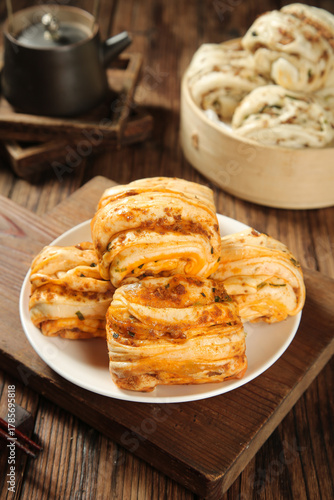 Wallpaper Mural Savory Scallion Pancake Rolls with Meat Filling and Steamed Buns on Rustic Wooden Table Torontodigital.ca