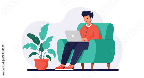 A young man comfortably works remotely on his laptop from a teal armchair, wearing earphones, with a green potted plant nearby.