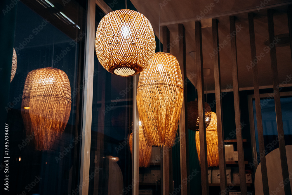 custom made wallpaper toronto digitalA row of wooden lamps with a warm glow. The lamps are hanging from the ceiling and are lit up.
