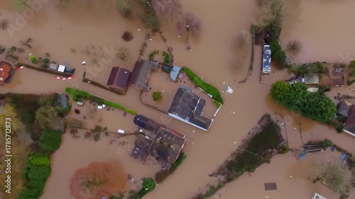 Aerial view of flooded houses in a village in the UK.
