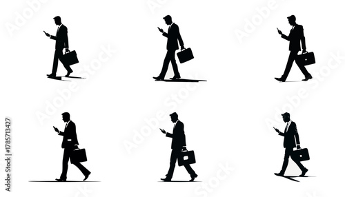 Silhouette images of a businessman walking while looking at his phone, carrying a briefcase