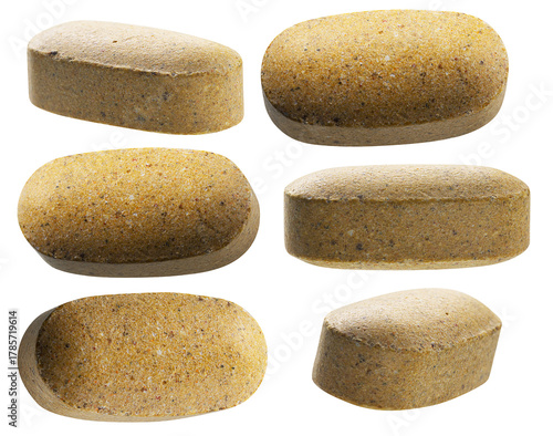 Tablou pe pânză six large, textured, oblong dietary supplement tablets or multivitamin pills arranged against a transparent background, photographed in a high-resolution studio setting