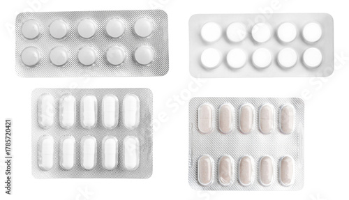collection of four different types of white and light-colored pharmaceutical pills and capsules stored securely within silver blister packs, isolated on black.
