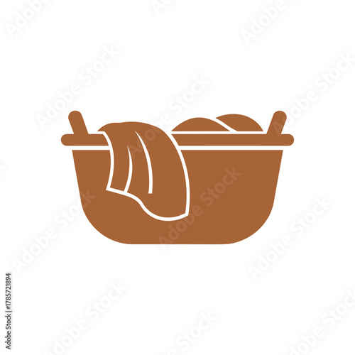 A simple brown icon of a laundry basket filled with clothes on a white background.