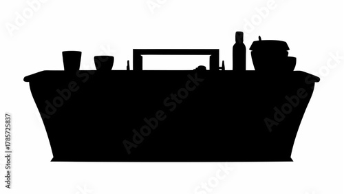 Silhouette of a long table with various items including bottles cups and boxes against a white background