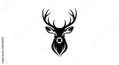 A stark black stag head with prominent antlers stands centered against a plain white background