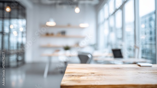 Wallpaper Mural Empty wooden desk in foreground, office interior blurring into soft focus, providing a modern workspace background for creativity and business concepts Torontodigital.ca