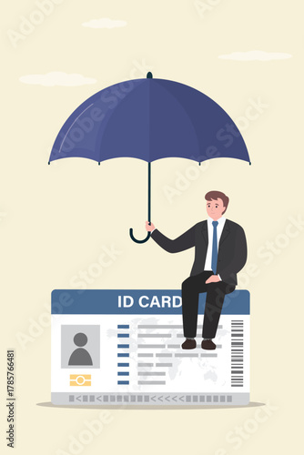 Businessman or user sitting on ID card and covered by big umbrella. Id card or profile protection. Protection against hacking, virus attacks, data theft.