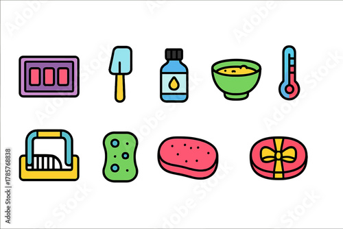 Colorful household items and cooking utensils on green background