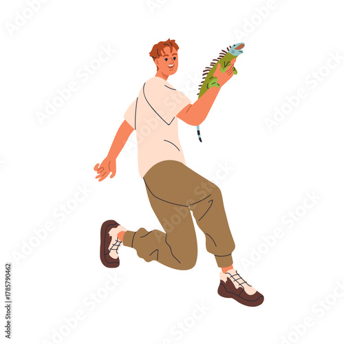 Happy man with iguana, exotic pet owner. Excited smiling person holding tropi...