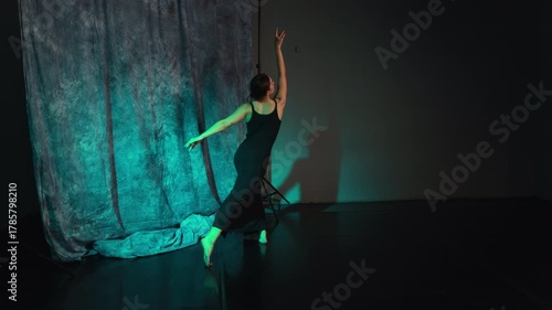 Dancing in the choreography studio. A young woman trains ballet movements