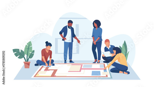 Diverse team collaborating on a floor plan or strategy game brainstorming ideas and planning together