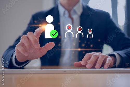 Businessman typing on keyboard working with with virtual human resource interface on laptop, representing HR management, employee analytics, digital recruitment, and workforce optimization strategy