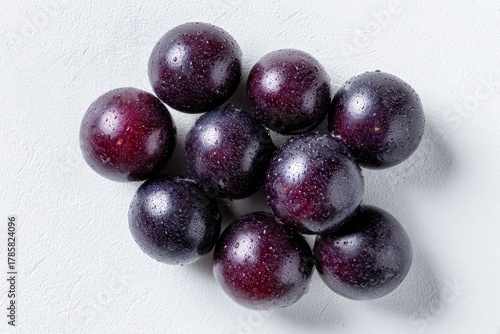 Wallpaper Mural Minimalist composition of acai berries on a white background, soft lighting Torontodigital.ca