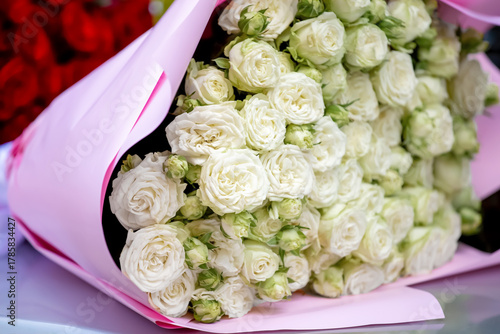 A huge bouquet of white roses. Flower delivery.