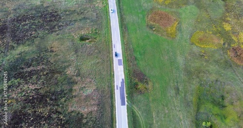Cars driving on rural country road aerial view