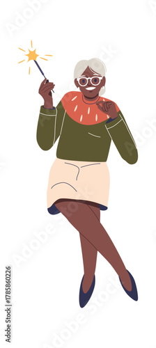 Happy elderly woman holding sparkler