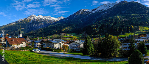 Canvas Print The village of Neukirchen am Grossvenediger at the foot of snow-covered mountain