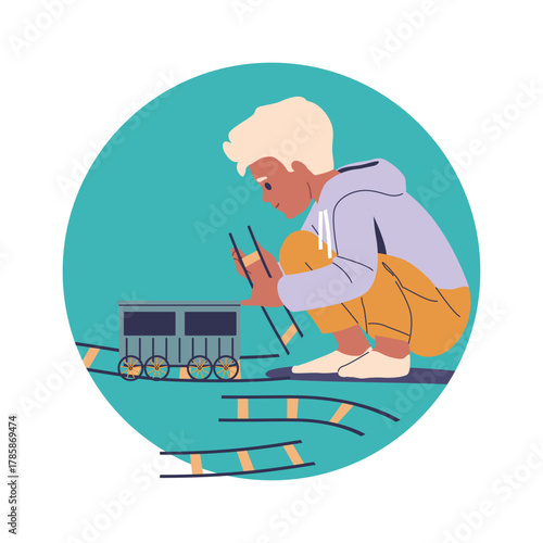 Little boy child building railway