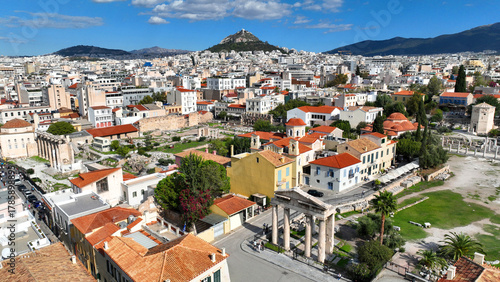 Fototapeta Naklejka Na Ścianę i Meble -  Aerial drone photo of iconic Roman Market featuring tower of Winds and Gate of Athena in the heart of Athens historic centre built in Plaka district, below Acropolis hill, Attica, Greece