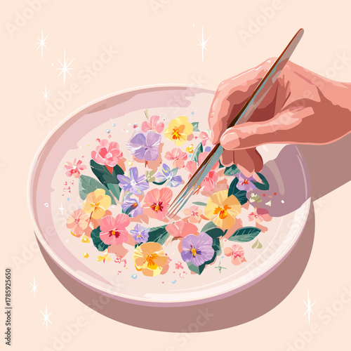 A hand with fork arranging flowers on a plate