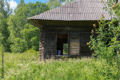 Ruins of an old abandoned wooden house in the countryside