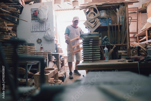 Carpenter working on wood in workshop