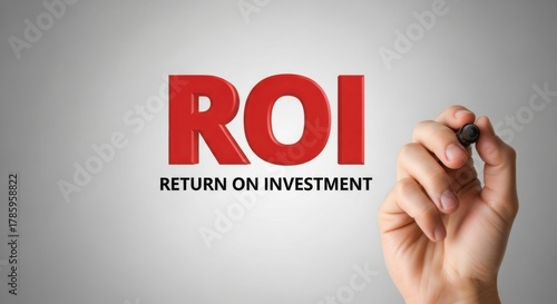 Hand writing return on investment roi on a grey background for business success