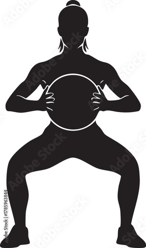 Silhouette of a woman exercising with fitness ball