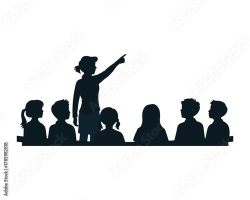 Silhouette of a teacher pointing upwards to a group of attentive students in a classroom setting