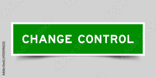 Green color square shape sticker label with word change control on gray background